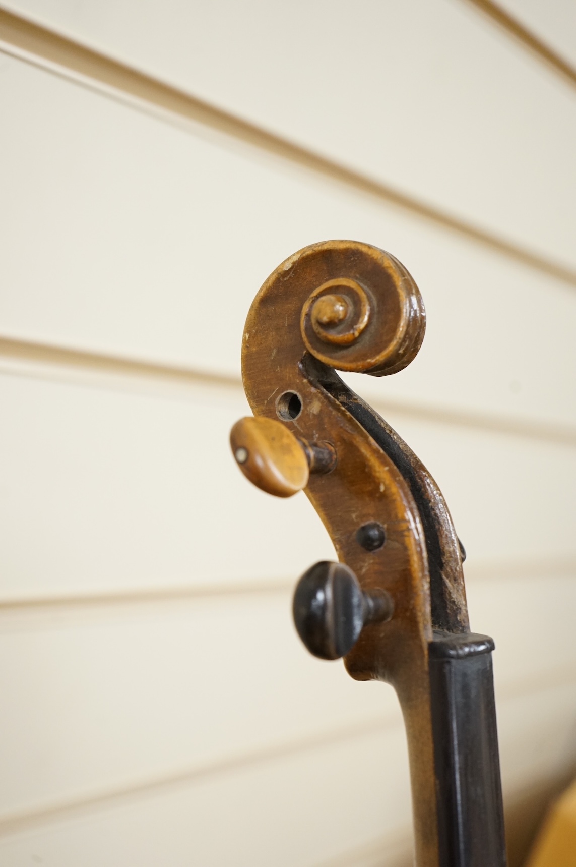 Four violins; a German Dresden violin, together with further two German violins, and a Saxony violin, three in cases or the remains of cases.